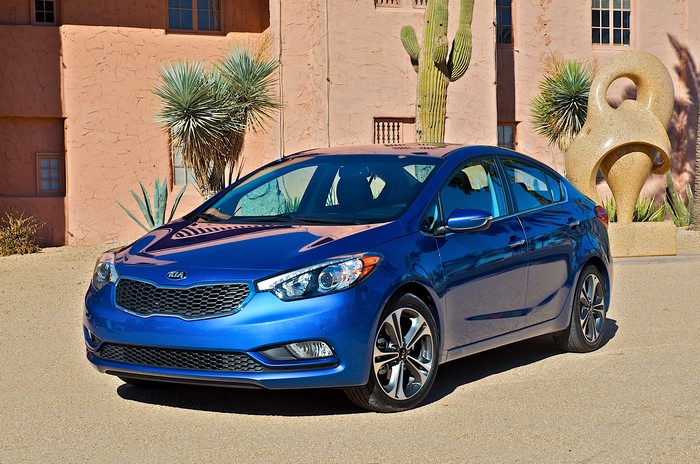 Blue Kia Forte Sedan in Desert Landscape