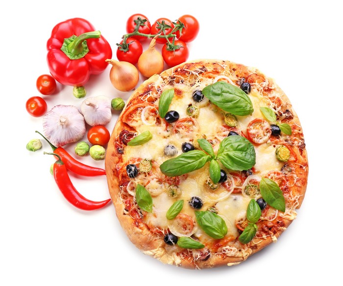 Pizza with fresh vegetables and herbs