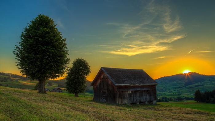 4K Switzerland Scenery with Barn at Sunset