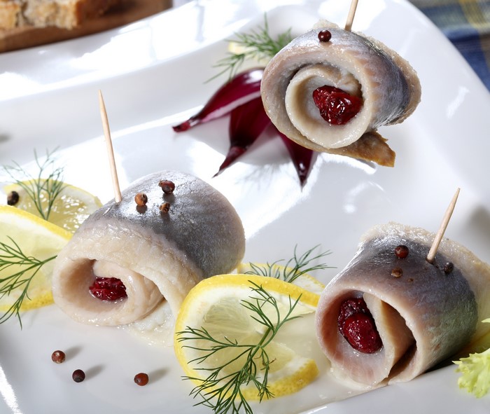 Rolled herring with cranberries, lemon, and dill