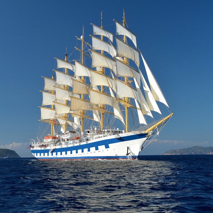 Tall ship with white sails on the sea