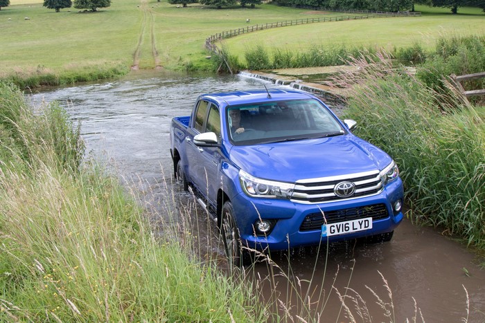 Blue 2016 Toyota Hilux Invincible Double Cab driving through water