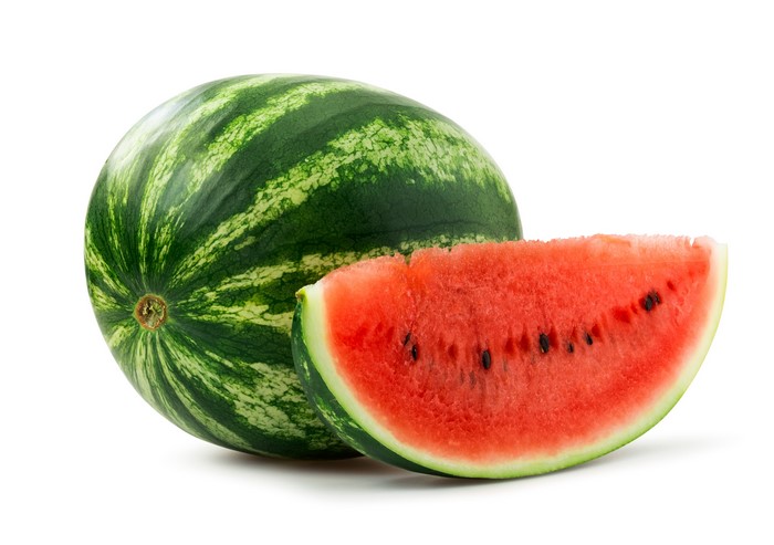 Watermelon with a slice on a white background