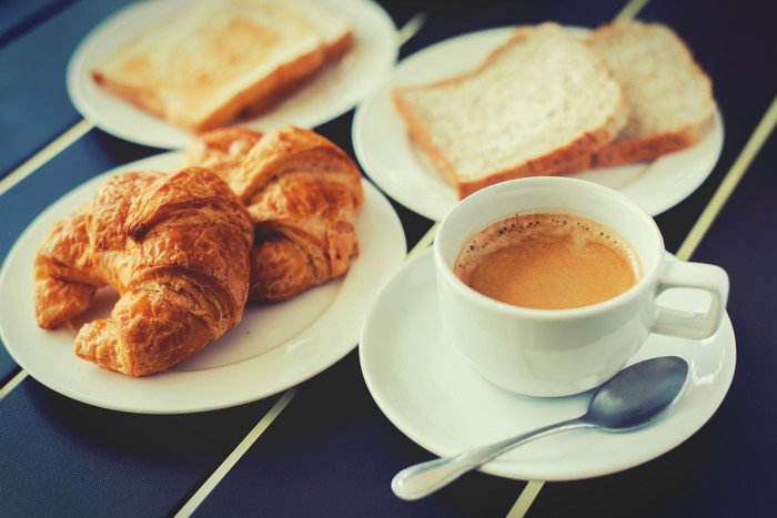 Coffee, Croissants, and Toast on Plates