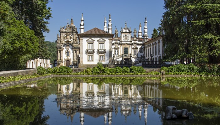 Palace and pond reflection in Mateus, Portugal