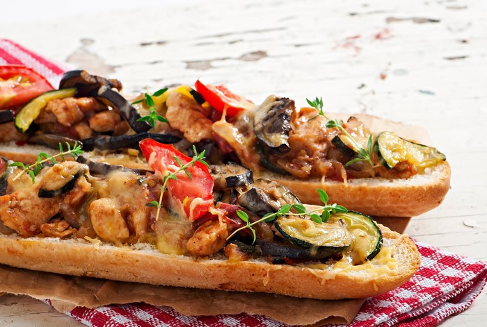 Open-faced sandwiches with chicken and vegetables