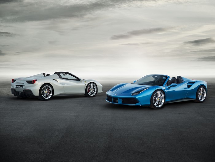 Two Ferrari 488 Spider convertibles on asphalt