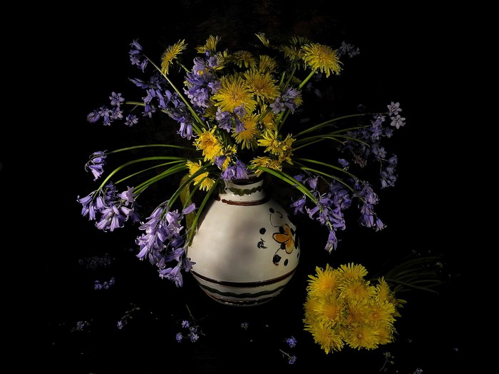 Bouquet of Dandelions and Bluebells in a Vase