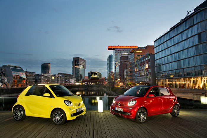 Two Smart Cars in City at Dusk