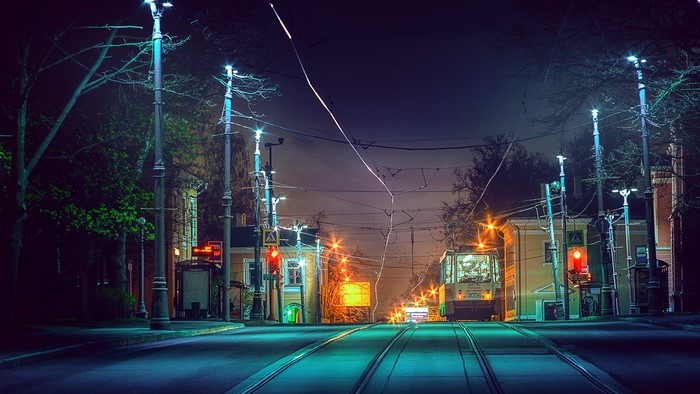 Street at night with tram in Koptevo, Moscow, Russia