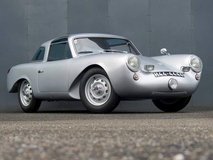Silver Porsche sports car with license plate H44-4444