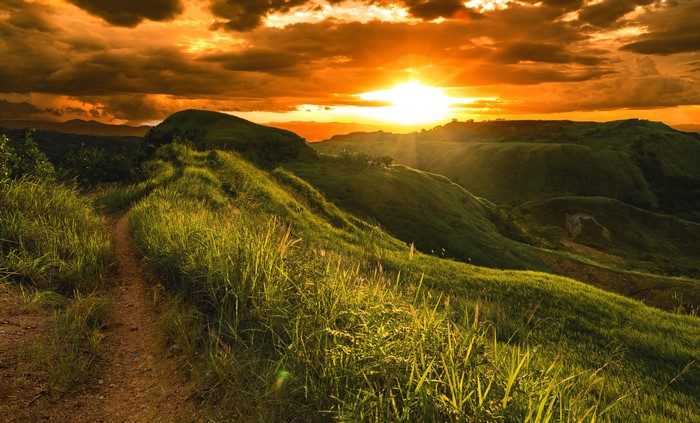 4K Sunrise over grassy hills in Arakan North Cotabato Philippines