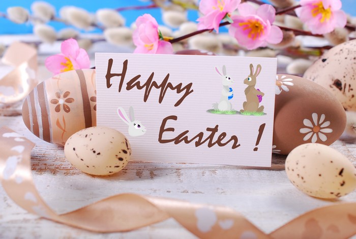 Easter eggs and flowers with a Happy Easter card
