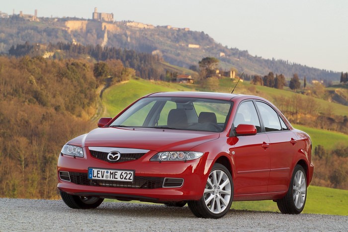 Red Mazda 6 Sedan in a Tuscan Landscape