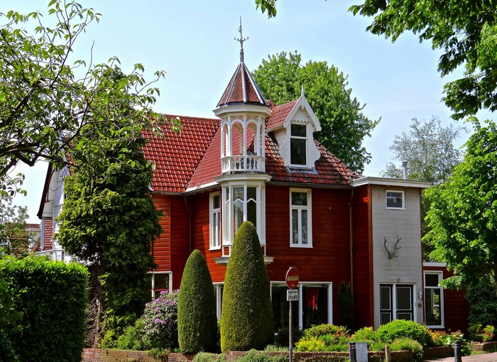 Red wooden house with turret in Naarden, Netherlands