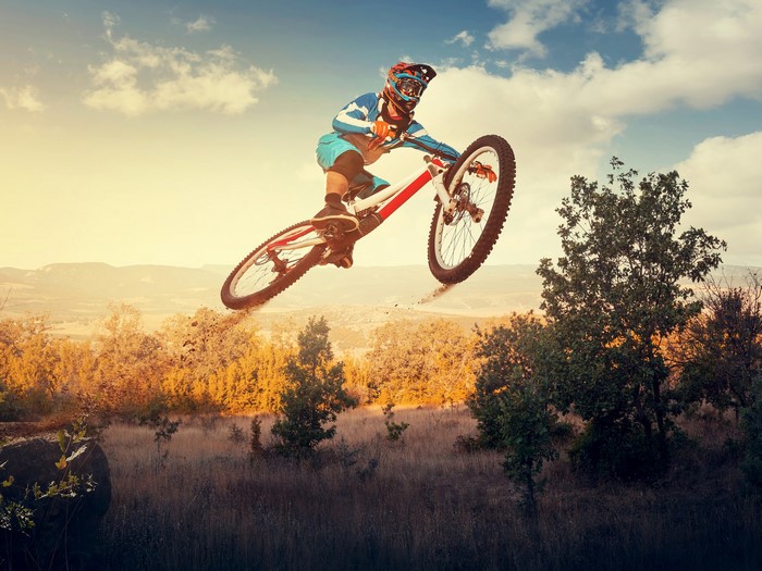 Mountain biker performing a jump in the air