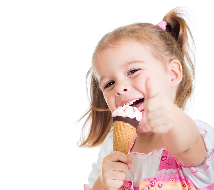 Girl eating ice cream and giving thumbs up
