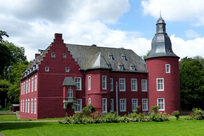 Burg Alsdorf castle in Germany with green lawn