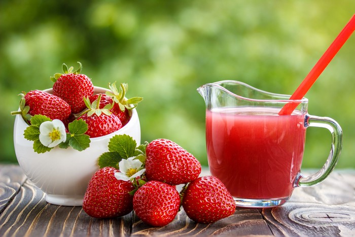 Strawberries and Strawberry Juice in a Pitcher