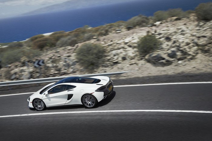 White McLaren 570GT on a Coastal Road