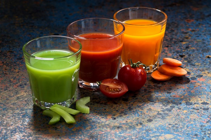 Three glasses of juice with vegetables