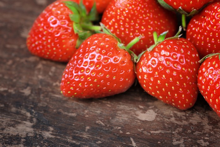 Strawberries on a wooden surface