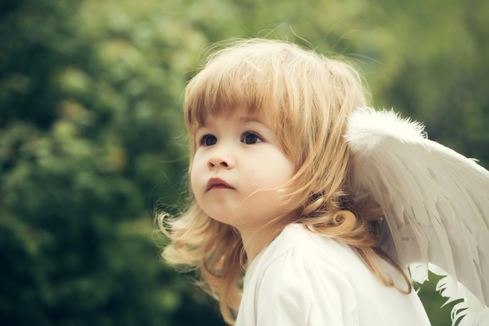 Little girl with angel wings