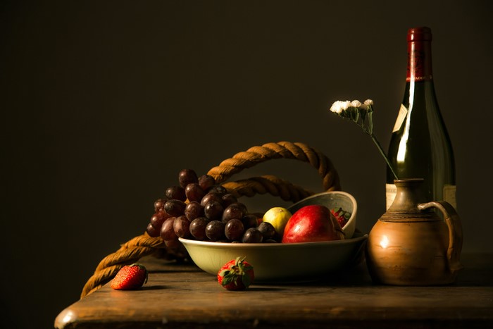 Still-life with wine bottle, grapes, strawberries, and jug