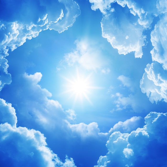 Bright Sun in a Blue Sky with Puffy Clouds 4K