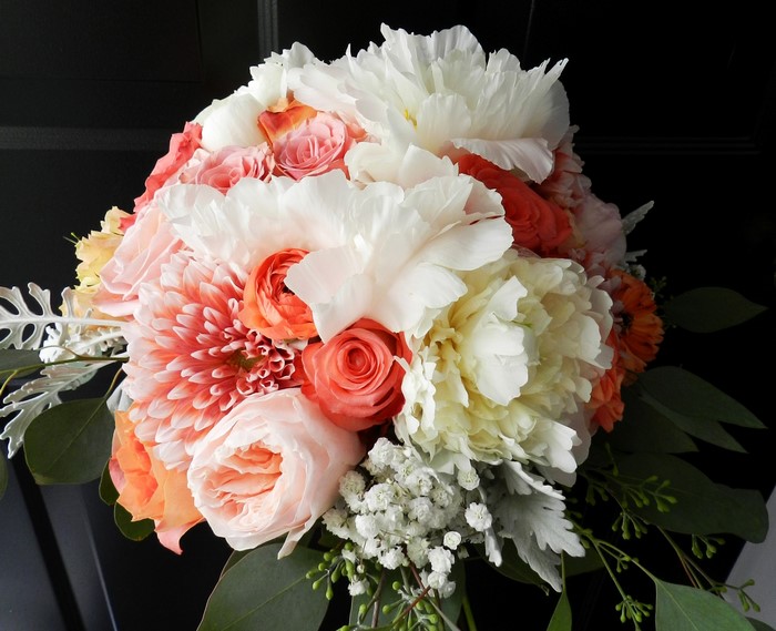 Coral and white floral bouquet with greenery