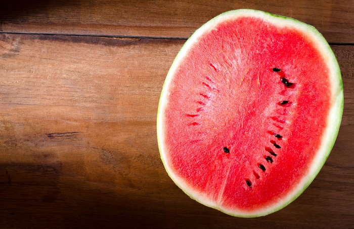 Slice of watermelon on wooden table