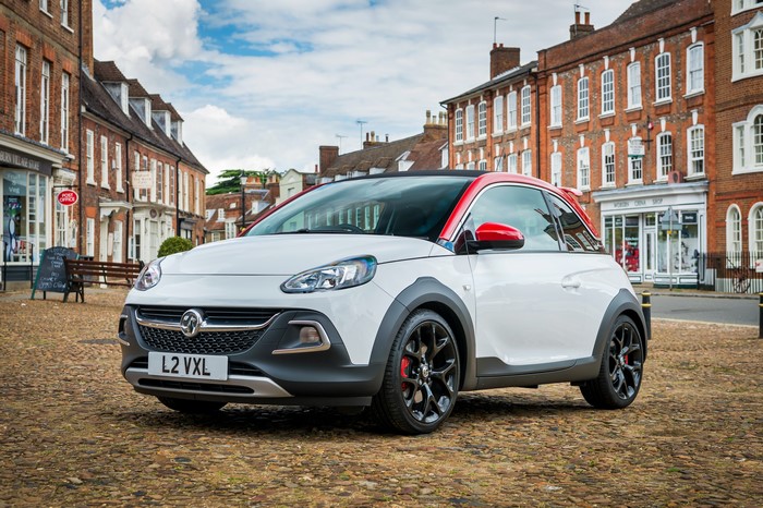 White Vauxhall Adam Rocks S parked on cobblestone street