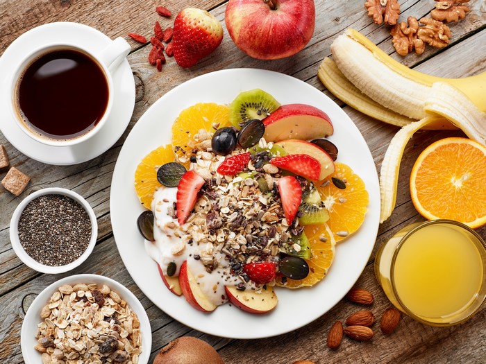 Healthy Breakfast with Muesli, Fruit, Coffee, and Juice