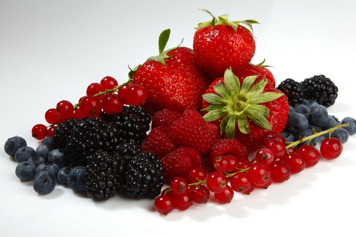 Assortment of fresh berries including strawberries, blueberries, blackberries, raspberries, and currants