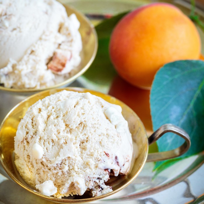 Peach Ice Cream in Brass Bowls with Apricot and Leaves
