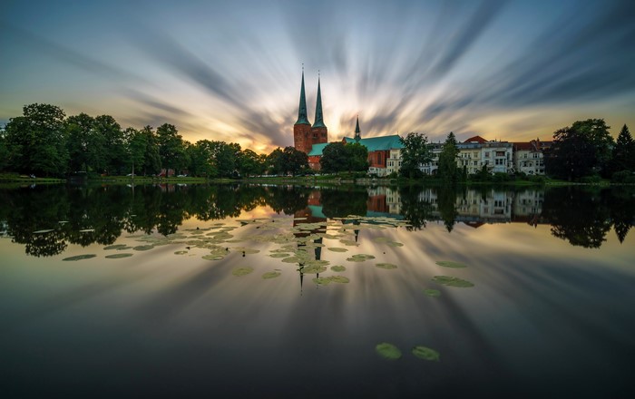 Lubeck Cathedral reflected in a pond at sunset