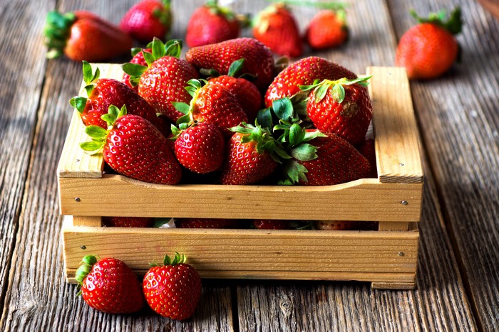 Strawberries in a wooden crate