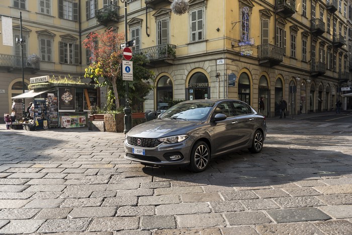 Grey Fiat Tipo 5-door on cobblestone street