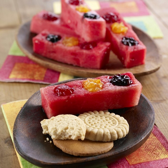 Watermelon slices with fruit and cookies