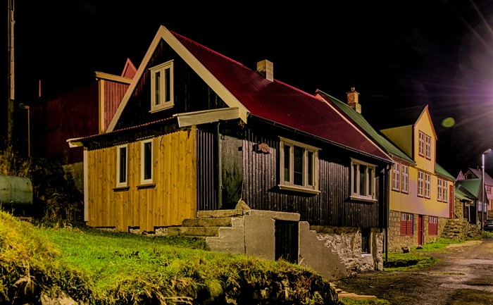Houses on a street at night in Klaksvik, Faroe Islands