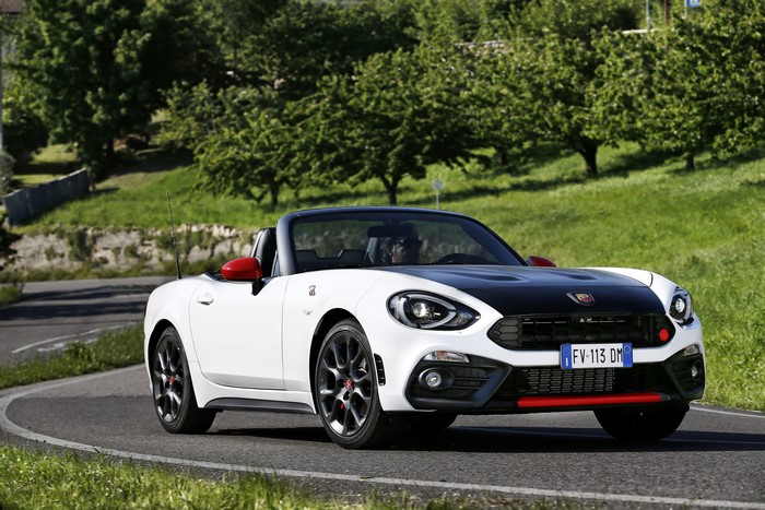 White Abarth 124 Spider Cabriolet driving on a road