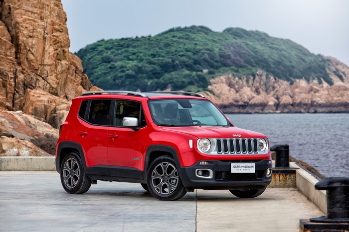 Red Jeep Renegade Limited on a rocky coast