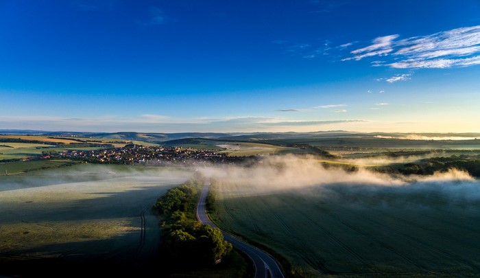 Aerial view of Sucha Loz, Czech Republic with fog and fields