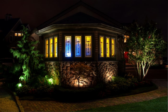 House with stained glass windows at night