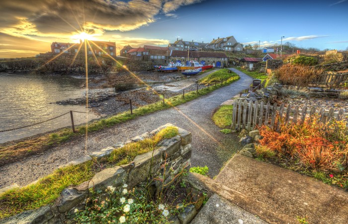 Craster Harbour England Coastline with Boats and Houses at Sunset