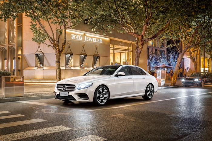 White Mercedes-Benz E-Class on a City Street at Night