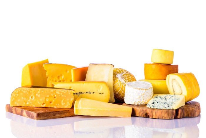Assortment of cheeses on a white background