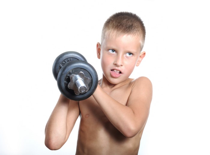 Boy holding a dumbbell