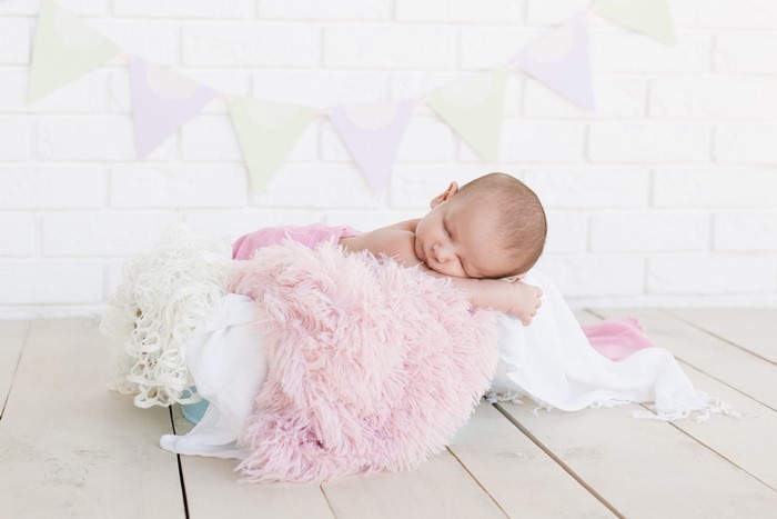 Newborn baby sleeping in a basket