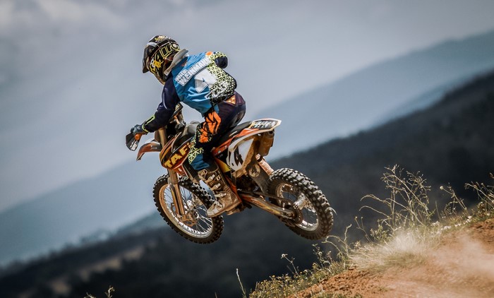Motocross rider in mid-air jump